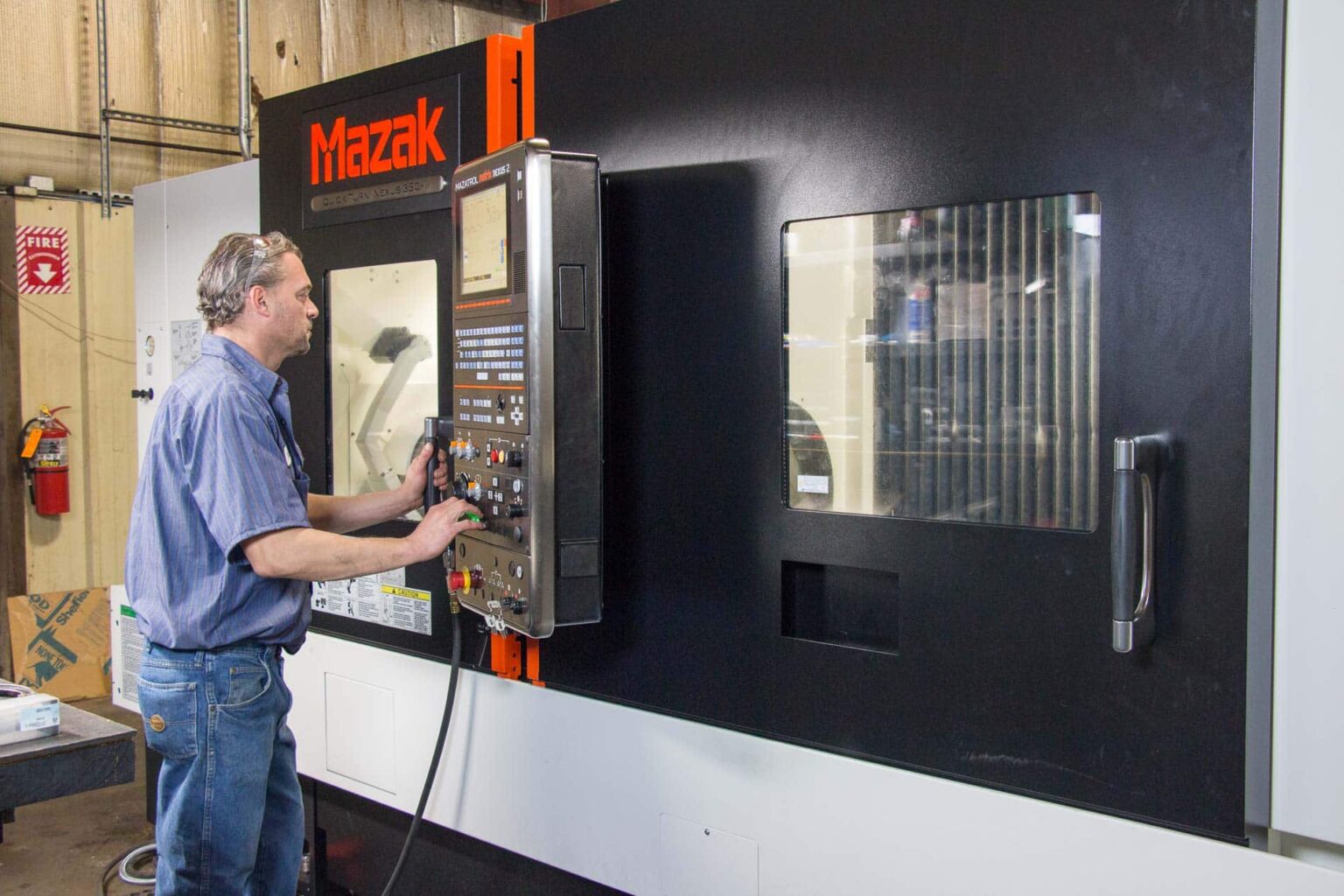 Employee working Mazak equipment